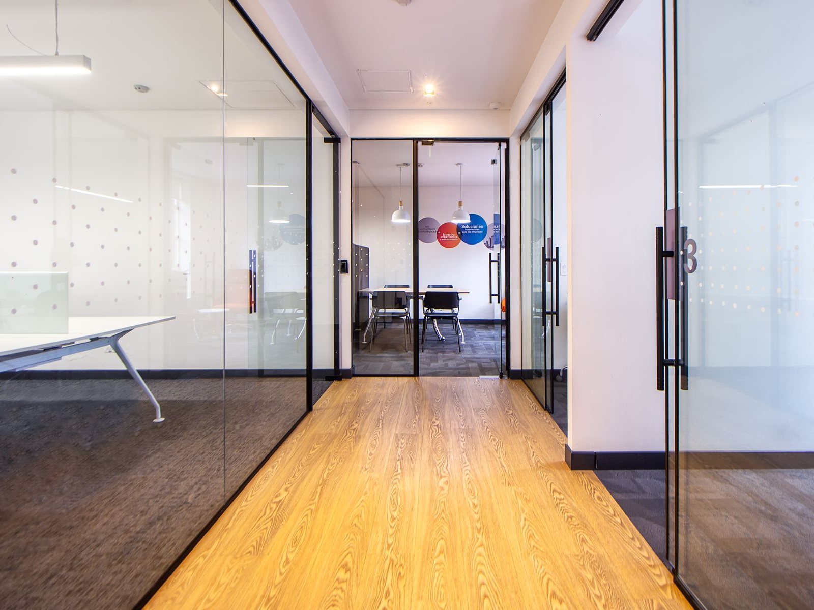 Office glass partition with a glass door