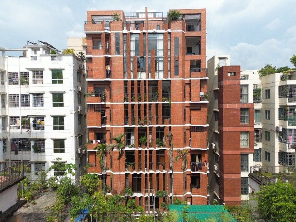 Street elevation of the eleven-storey brick building at Mohammadia Housing with our aluminium windows and glass